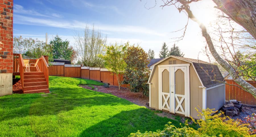 Fenced backyard with storage shed in Seattle